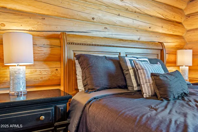a bathroom with a double vanity sink and a large mirror