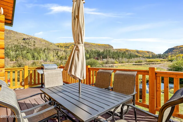 a view of a balcony with furniture and window