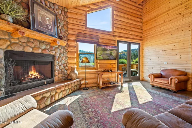 a view of a patio with couches chairs and a fireplace