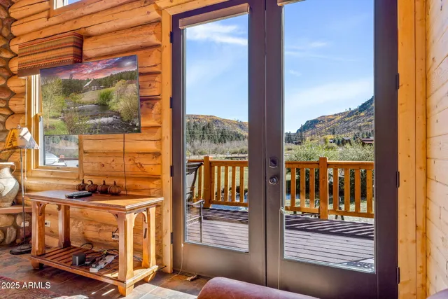 a view of a brick house with a large window