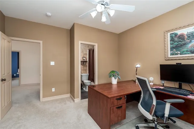 a view of workspace and livingroom with wooden floor
