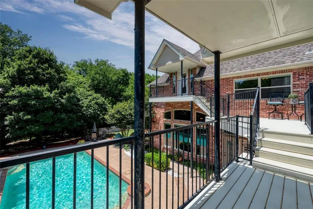 a view of balcony with floor to ceiling window and wooden floor
