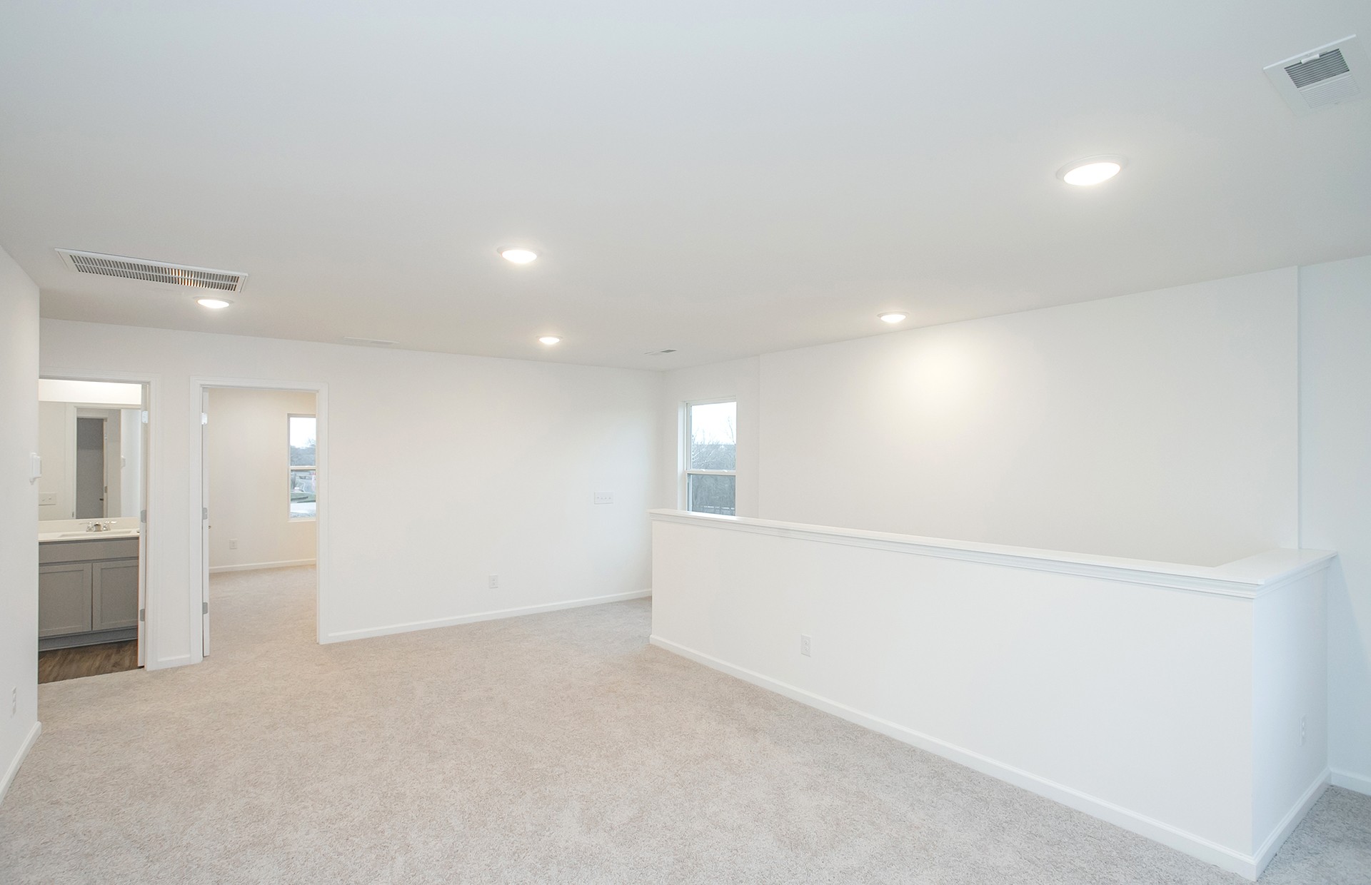 3591 Fellowship Road Columbia, TN 38401 - Photo 17 of 38 wooden floor in an empty room with a kitchen