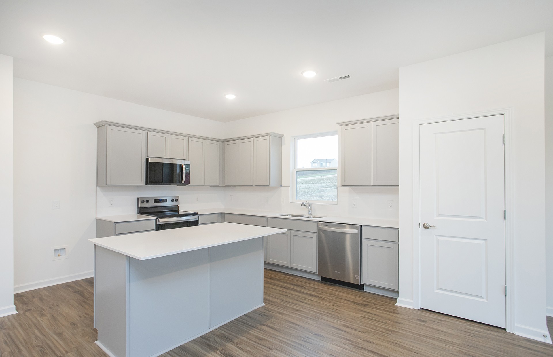 3591 Fellowship Road Columbia, TN 38401 - Photo 6 of 38 a kitchen with a sink cabinets and wooden floor