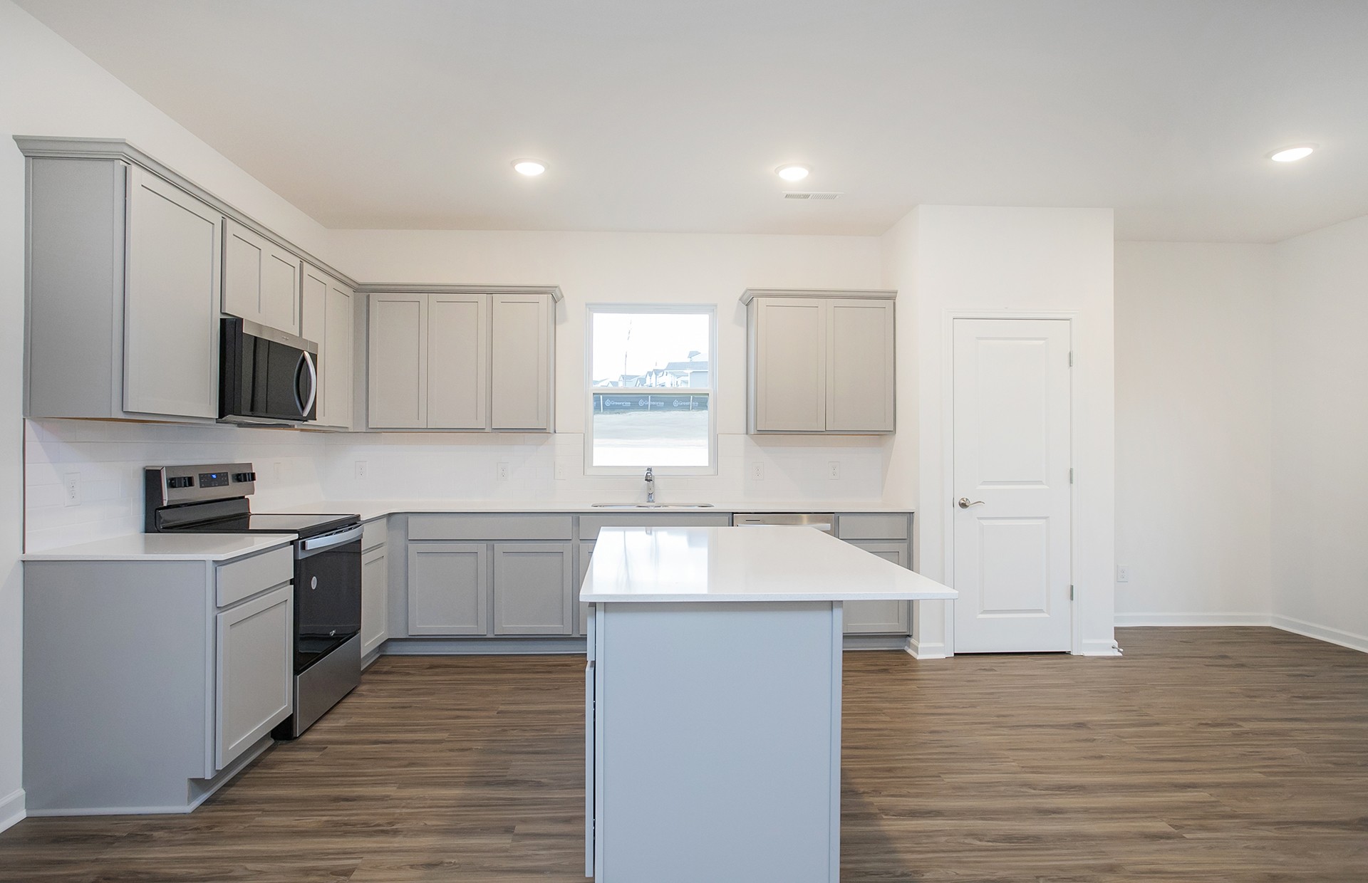 3591 Fellowship Road Columbia, TN 38401 - Photo 7 of 38 a kitchen with granite countertop a stove top oven sink and cabinets