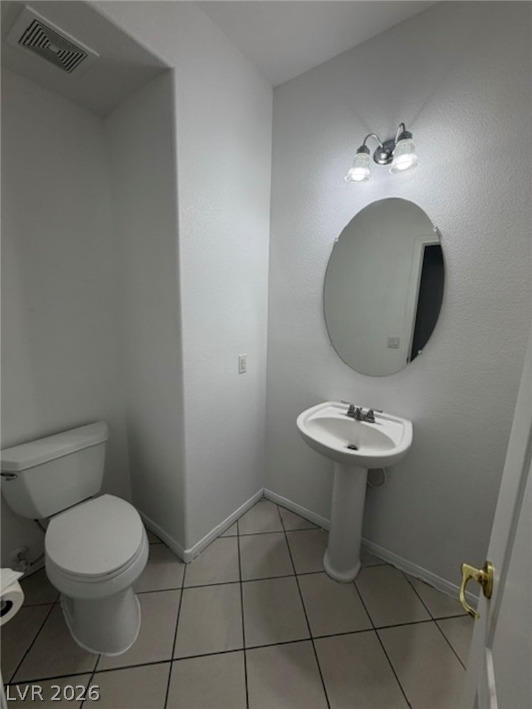 3862 Landing Ridge Place Las Vegas, NV 89135 - Photo 7 of 26 A well-appointed powder room features a classic pedestal sink and ample lighting.