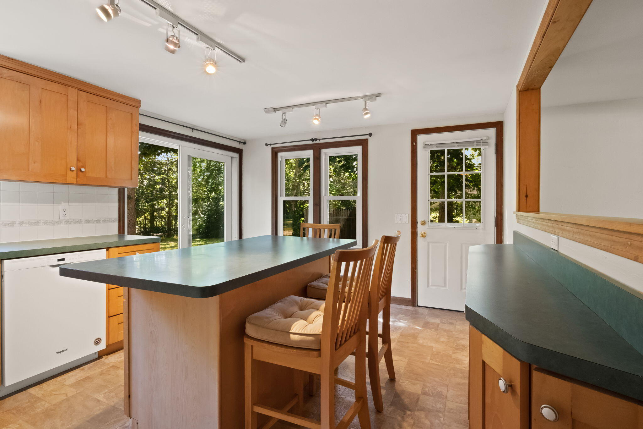 49 Russells Path Brewster, MA 02631 - Photo 14 of 37 a view of a kitchen area with furniture and windows