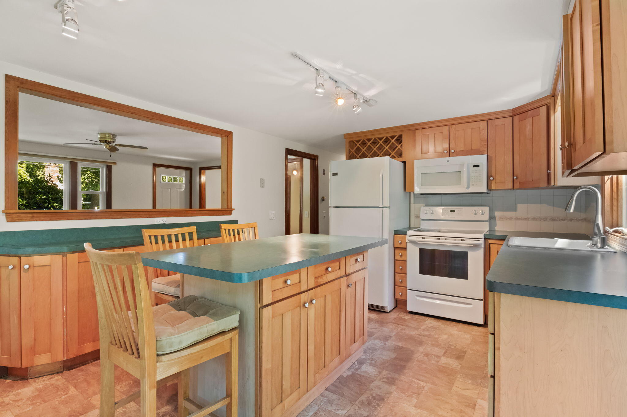 49 Russells Path Brewster, MA 02631 - Photo 15 of 37 a kitchen with stainless steel appliances granite countertop a stove and a refrigerator