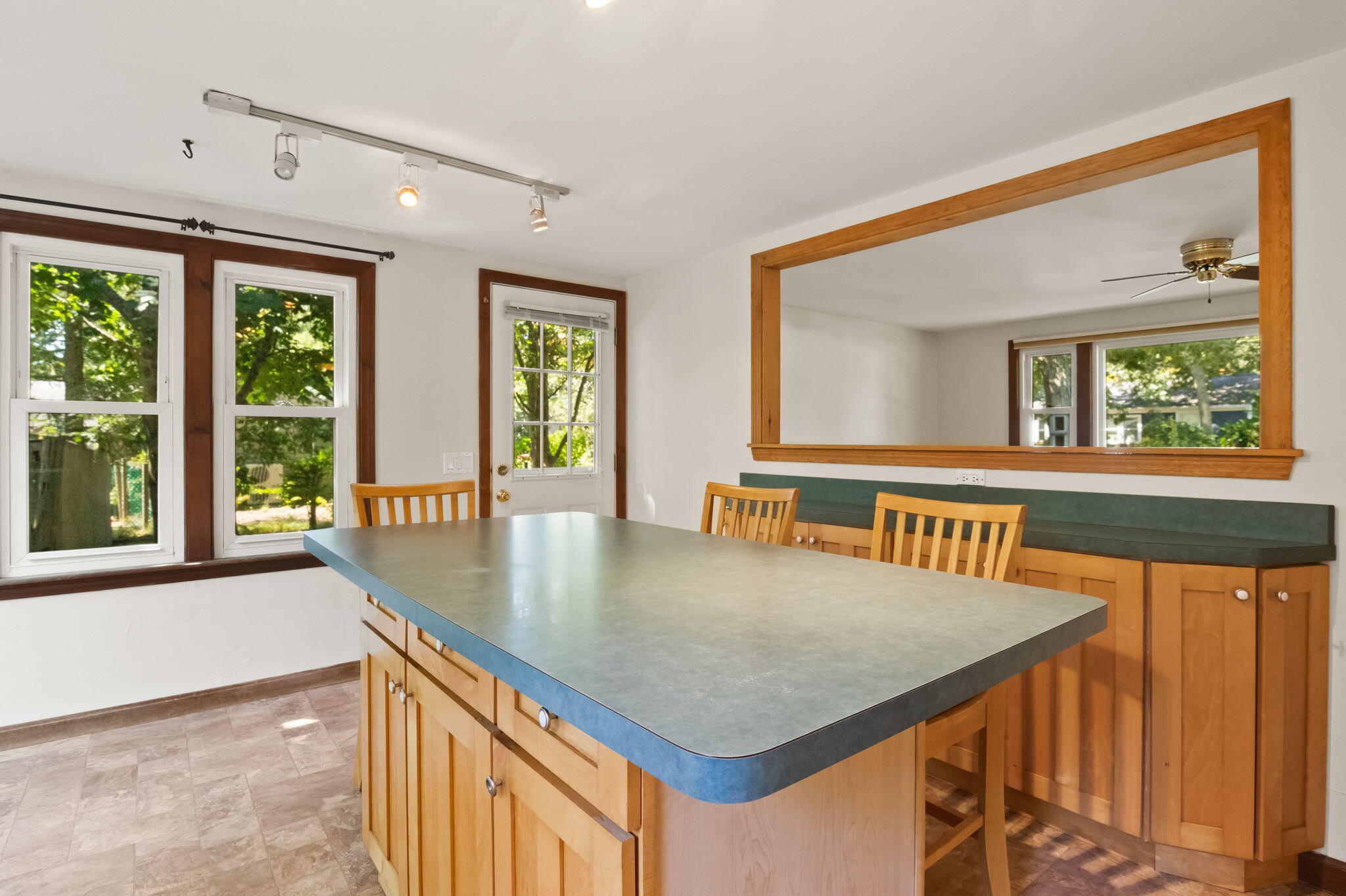 49 Russells Path Brewster, MA 02631 - Photo 16 of 37 a view of a living room and a kitchen with a table