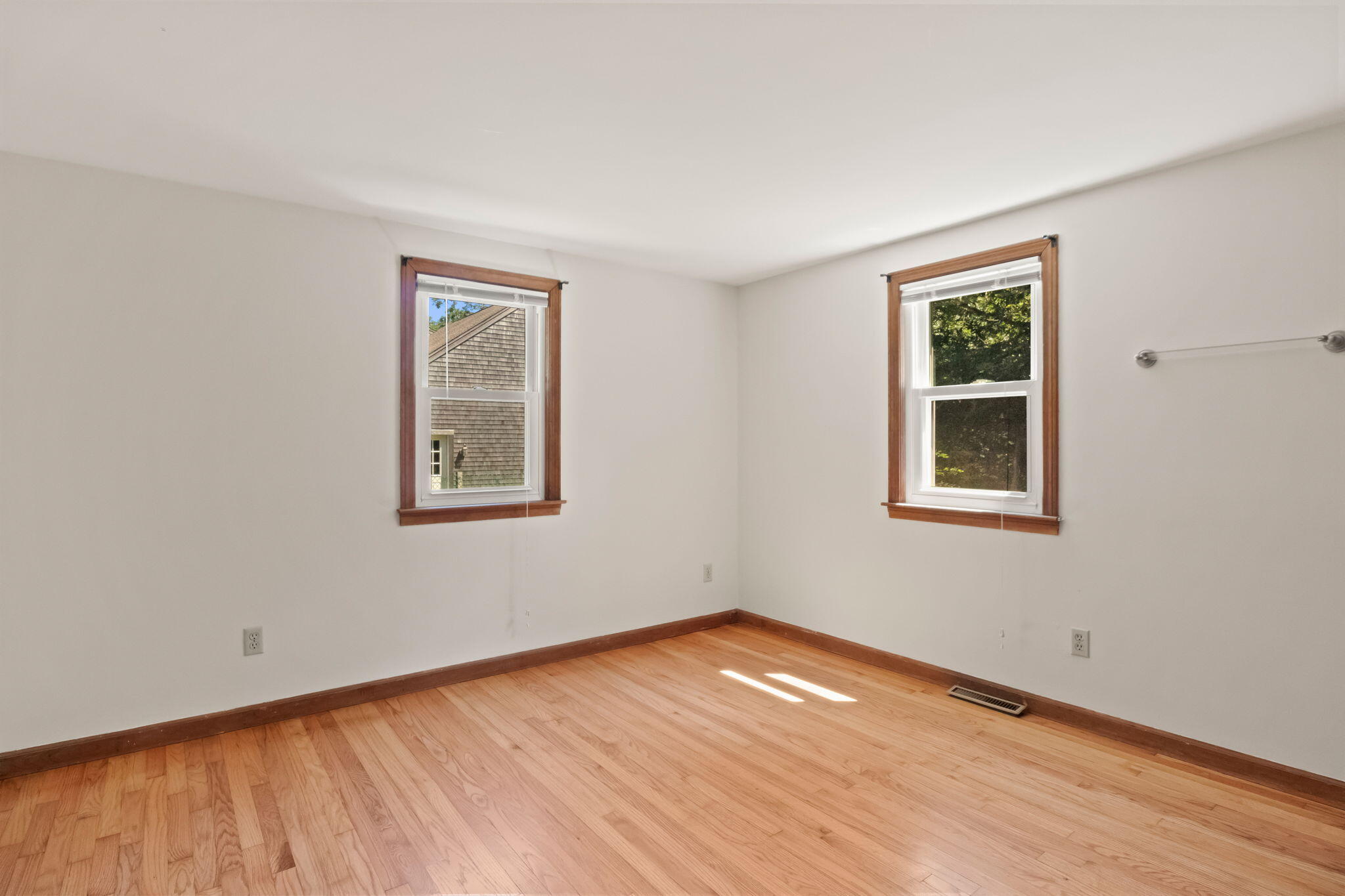 49 Russells Path Brewster, MA 02631 - Photo 20 of 37 a view of empty room with wooden floor and fan