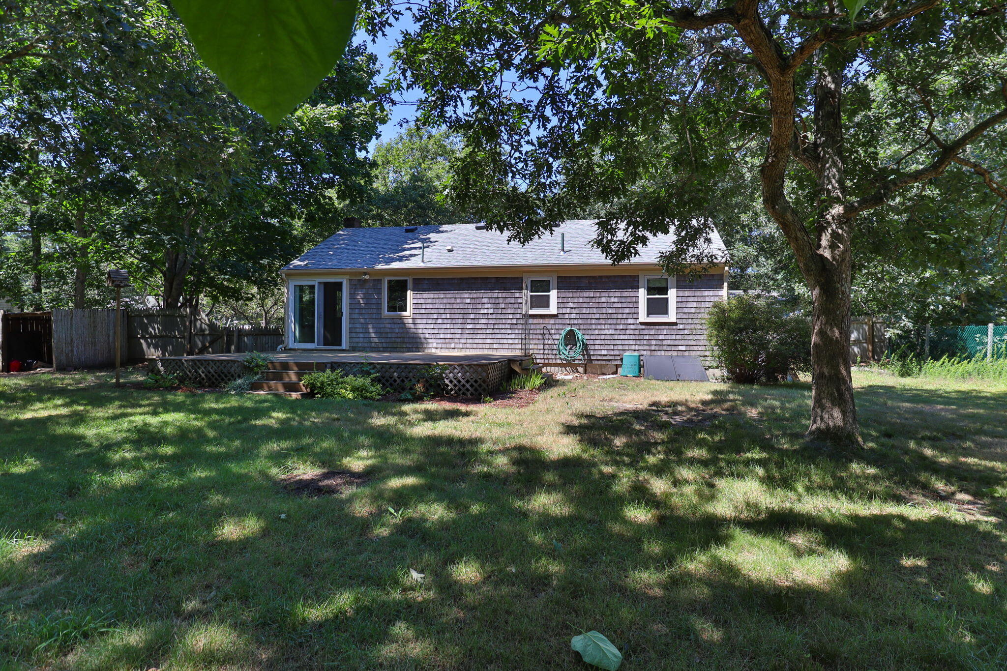 49 Russells Path Brewster, MA 02631 - Photo 31 of 37 a front view of a house with a garden