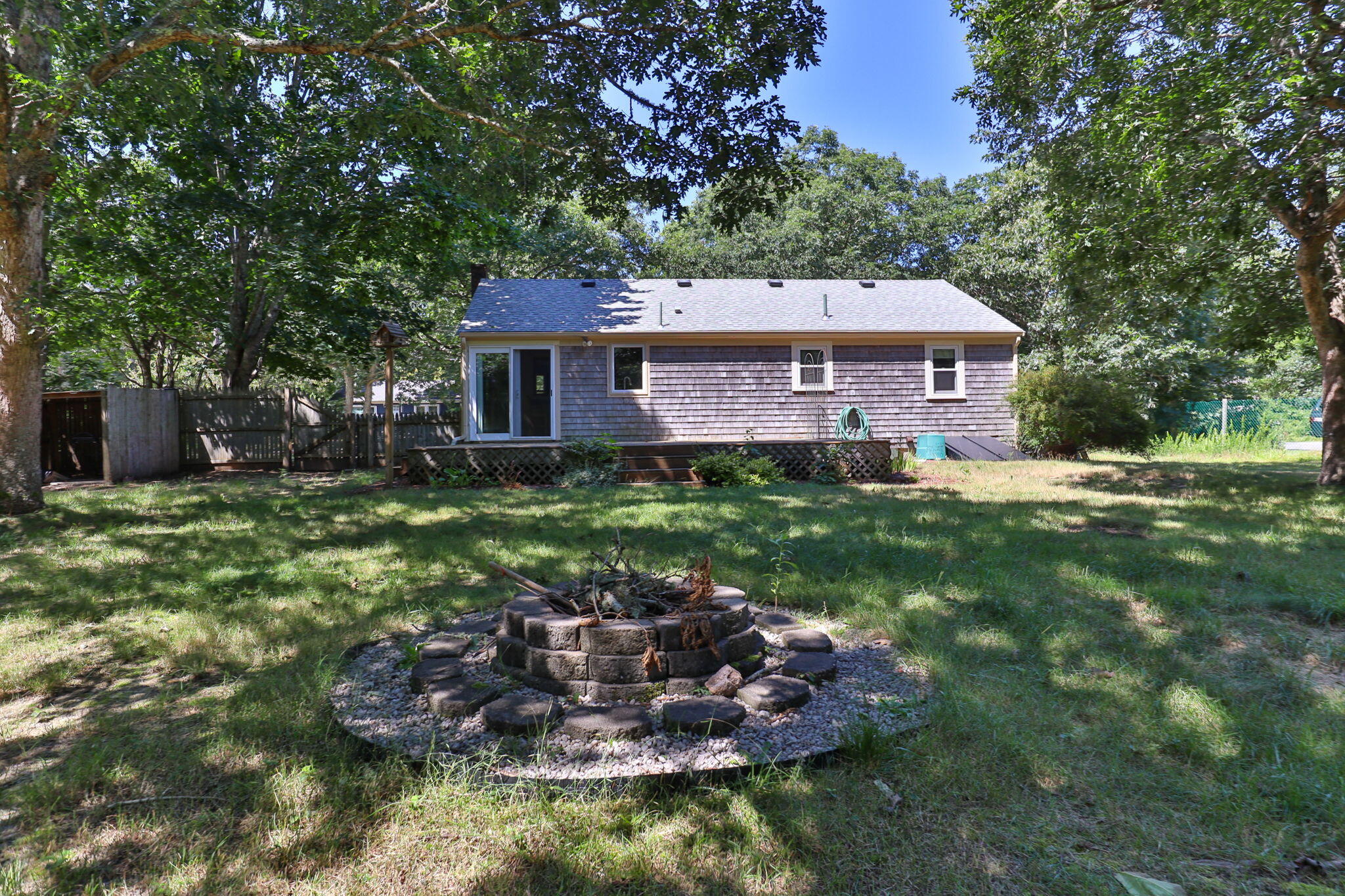49 Russells Path Brewster, MA 02631 - Photo 32 of 37 a view of a house with a yard