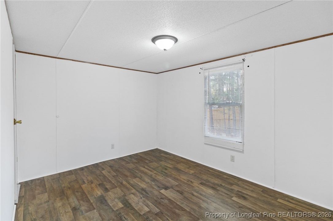 7321 Sheriff Watson Road Sanford, NC 27332 - Photo 22 of 26 a view of empty room with window and closet