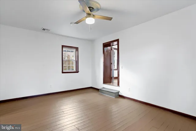 a view of a room that has a window in it