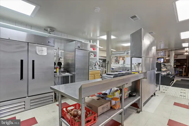 a outdoor space with lots of furniture and clutter