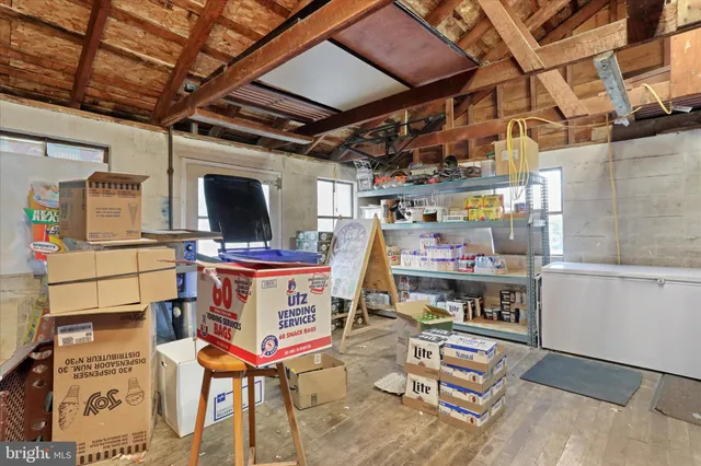 a kitchen with refrigerator and window