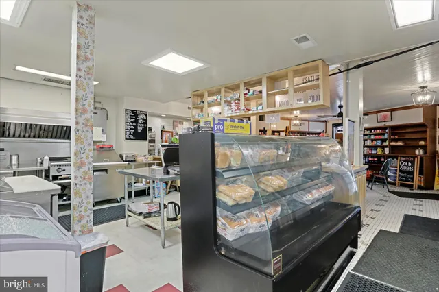 a kitchen with a stove and a refrigerator