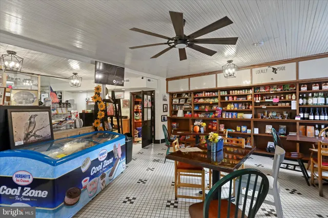 a room with fireplace furniture and a wooden floor