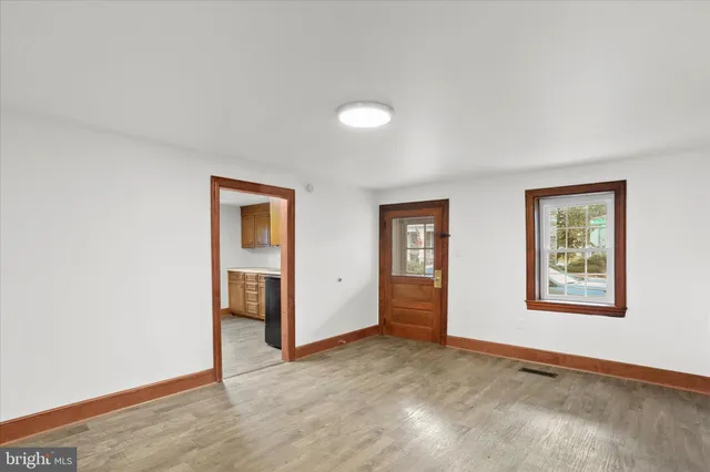 a kitchen with granite countertop cabinets sink and window