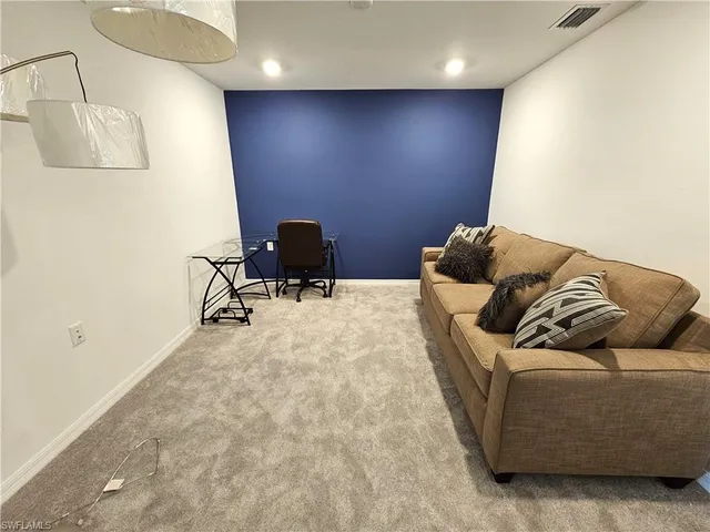 a living room with furniture and a couch