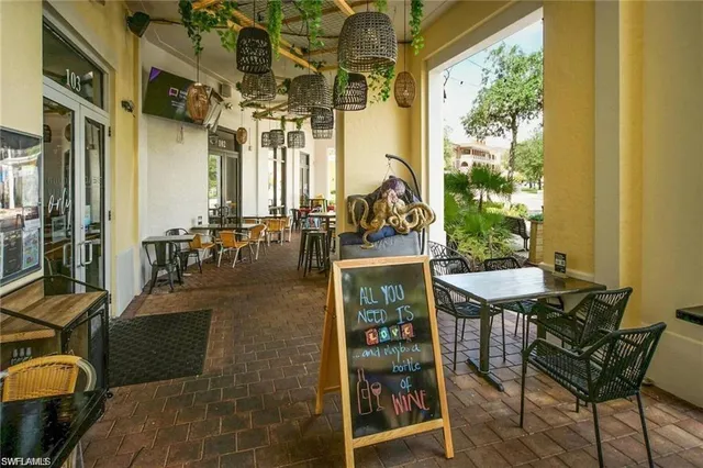 a view of a house with sitting area and garden