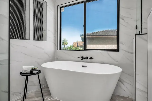 a bathroom with a bathtub and a sink