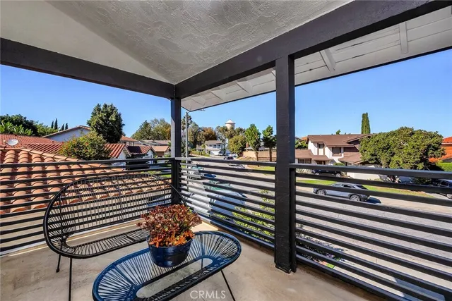 a outdoor living space with furniture and a potted plant
