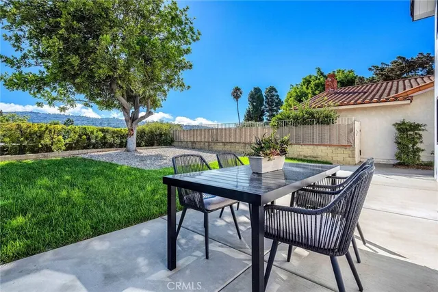 a view of an outdoor sitting area with furniture