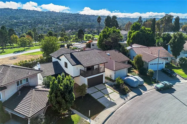 an aerial view of a house with a garden