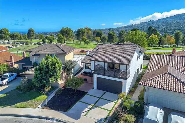 an aerial view of a house with a garden