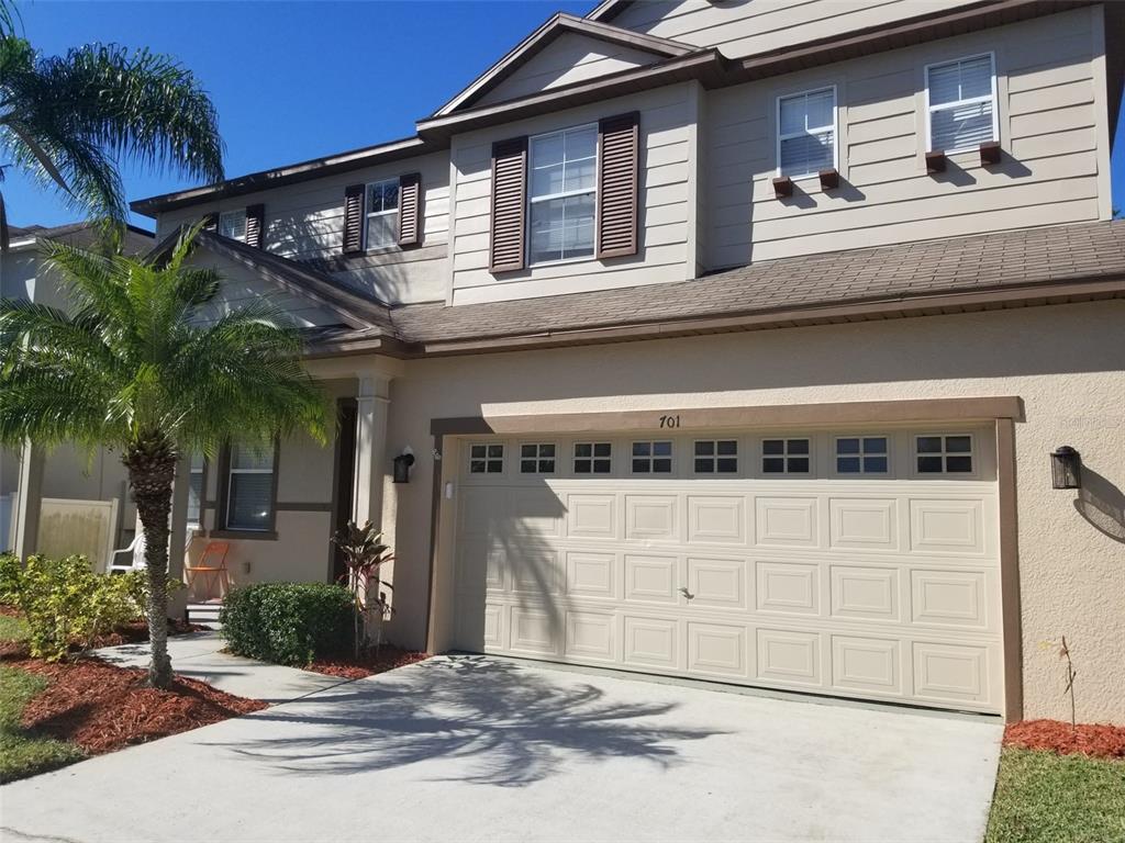 a front view of a house with a garage