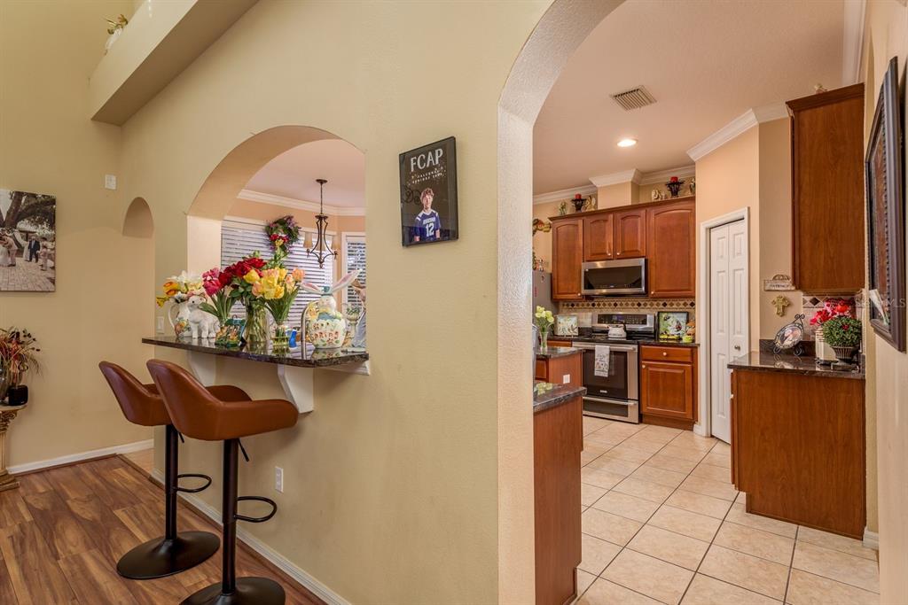 19216 Inlet Cove Court Lutz, FL 33558 - Photo 11 of 41 a view of kitchen with furniture and wooden floor