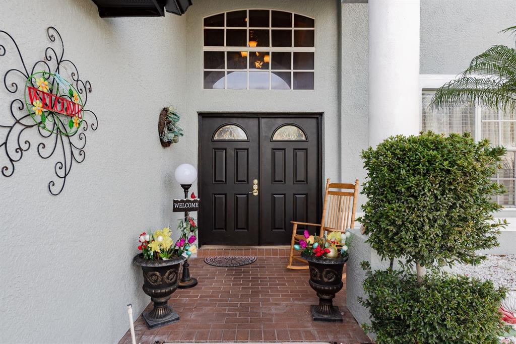 19216 Inlet Cove Court Lutz, FL 33558 - Photo 2 of 41 a front view of a house with outdoor seating