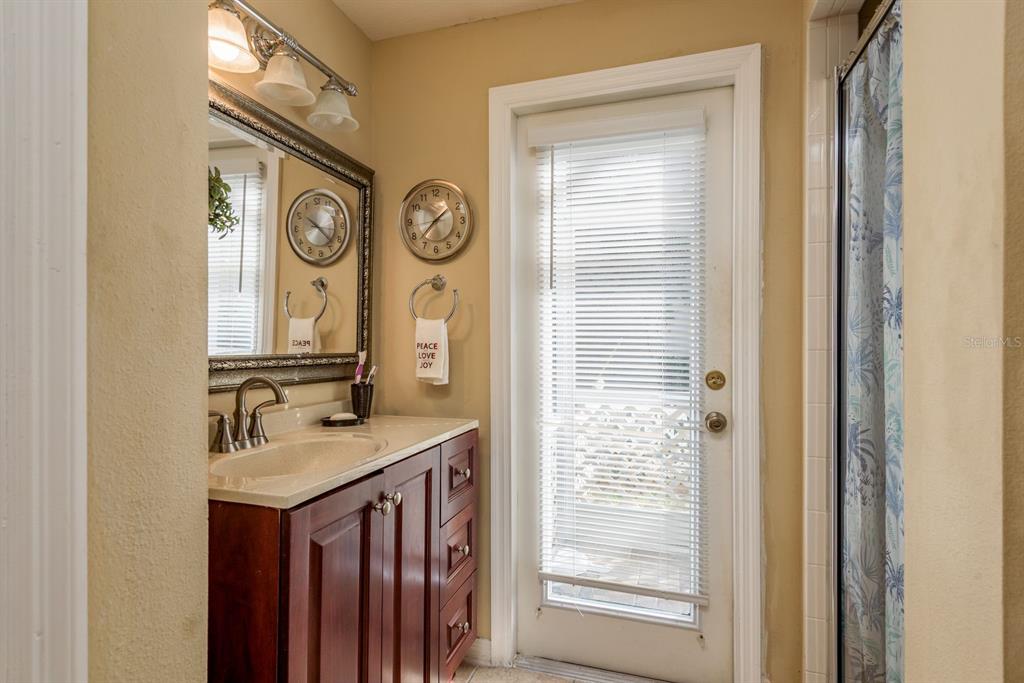 19216 Inlet Cove Court Lutz, FL 33558 - Photo 22 of 41 a bathroom with a sink and a mirror