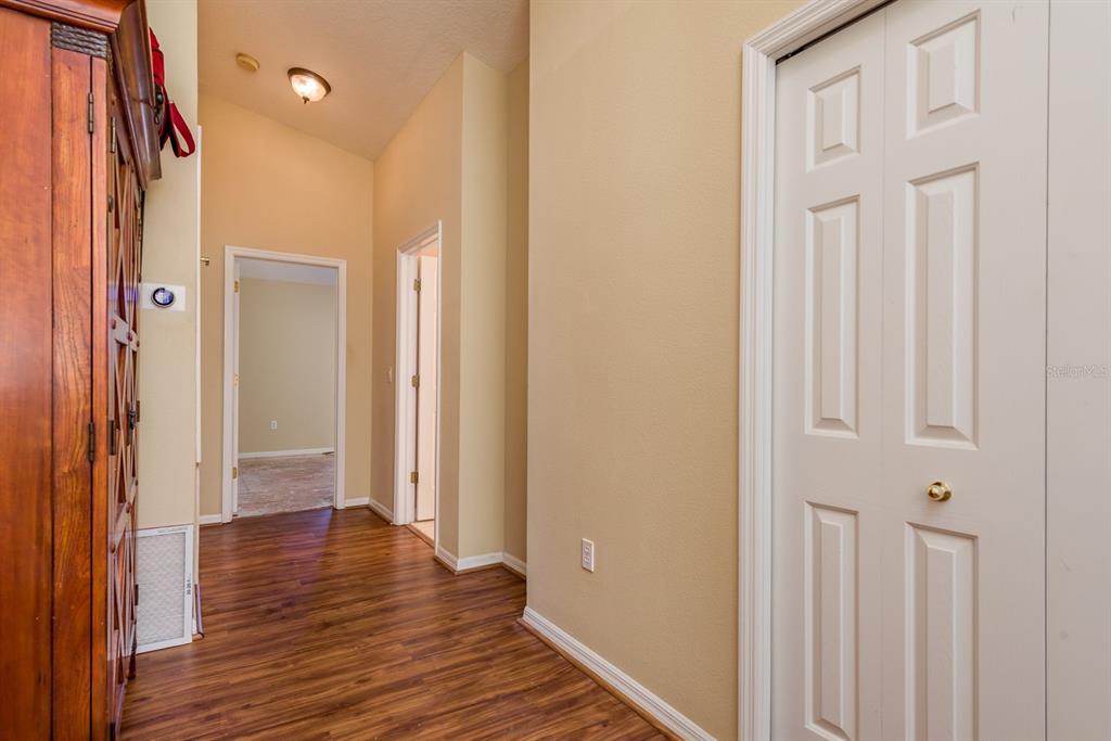 19216 Inlet Cove Court Lutz, FL 33558 - Photo 27 of 41 a view of a hallway with wooden floor