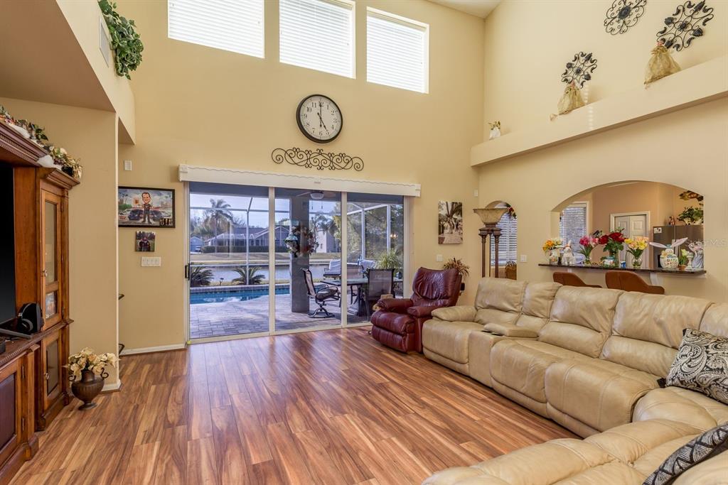 19216 Inlet Cove Court Lutz, FL 33558 - Photo 8 of 41 a living room with furniture and a large window