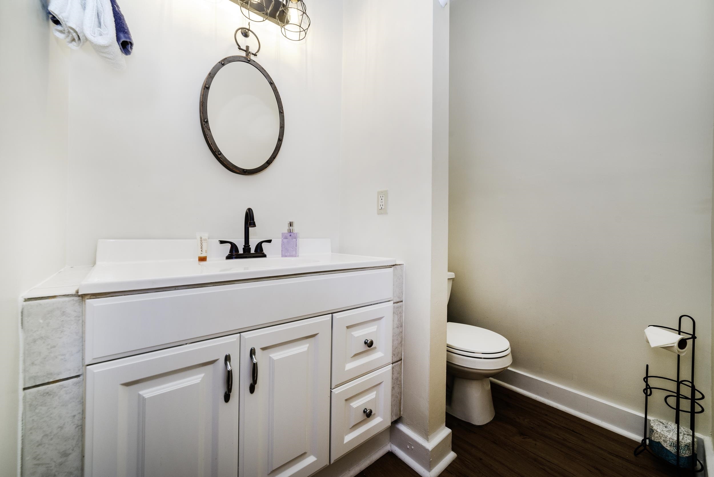 29 Cuna Street St. Augustine, FL 32084 - Photo 56 of 69 a bathroom with a toilet a sink and a mirror
