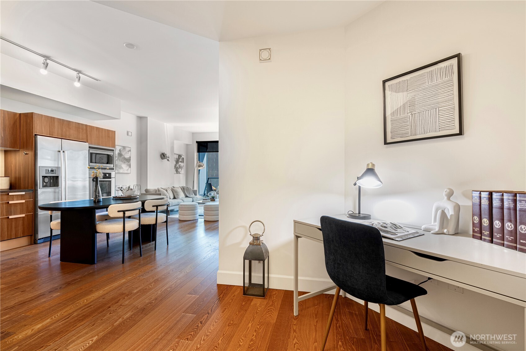 1920 4th Avenue, Unit 1809 Seattle, WA 98101 - Photo 11 of 30 a living room with furniture and wooden floor