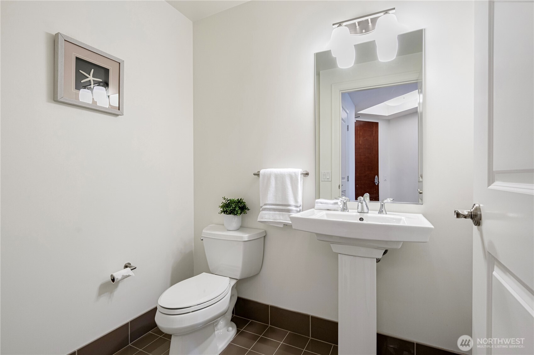 1920 4th Avenue, Unit 1809 Seattle, WA 98101 - Photo 12 of 30 a bathroom with a toilet sink and mirror