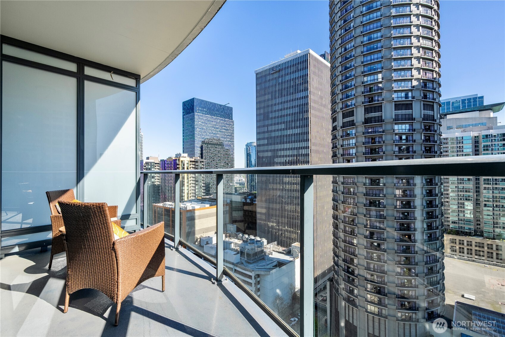 1920 4th Avenue, Unit 1809 Seattle, WA 98101 - Photo 17 of 30 a view of balcony with wooden floor and furniture