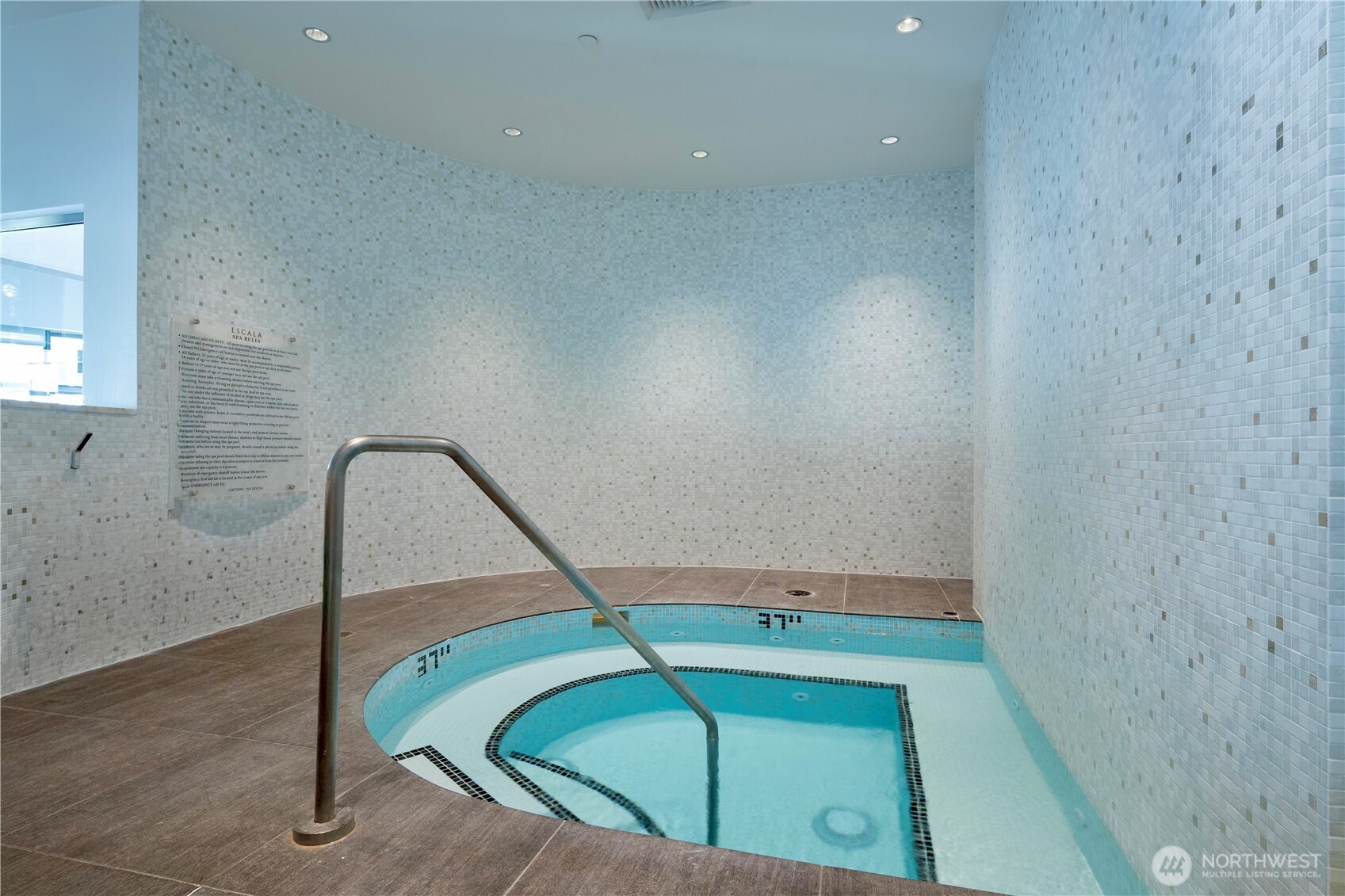 1920 4th Avenue, Unit 1809 Seattle, WA 98101 - Photo 20 of 30 a bathroom with a sink a toilet and a shower