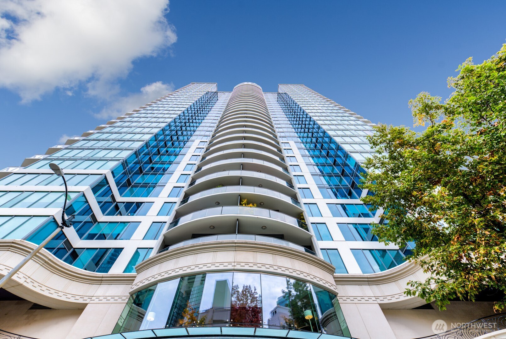 1920 4th Avenue, Unit 1809 Seattle, WA 98101 - Photo 2 of 30 a front view of a multi story residential apartment building with yard