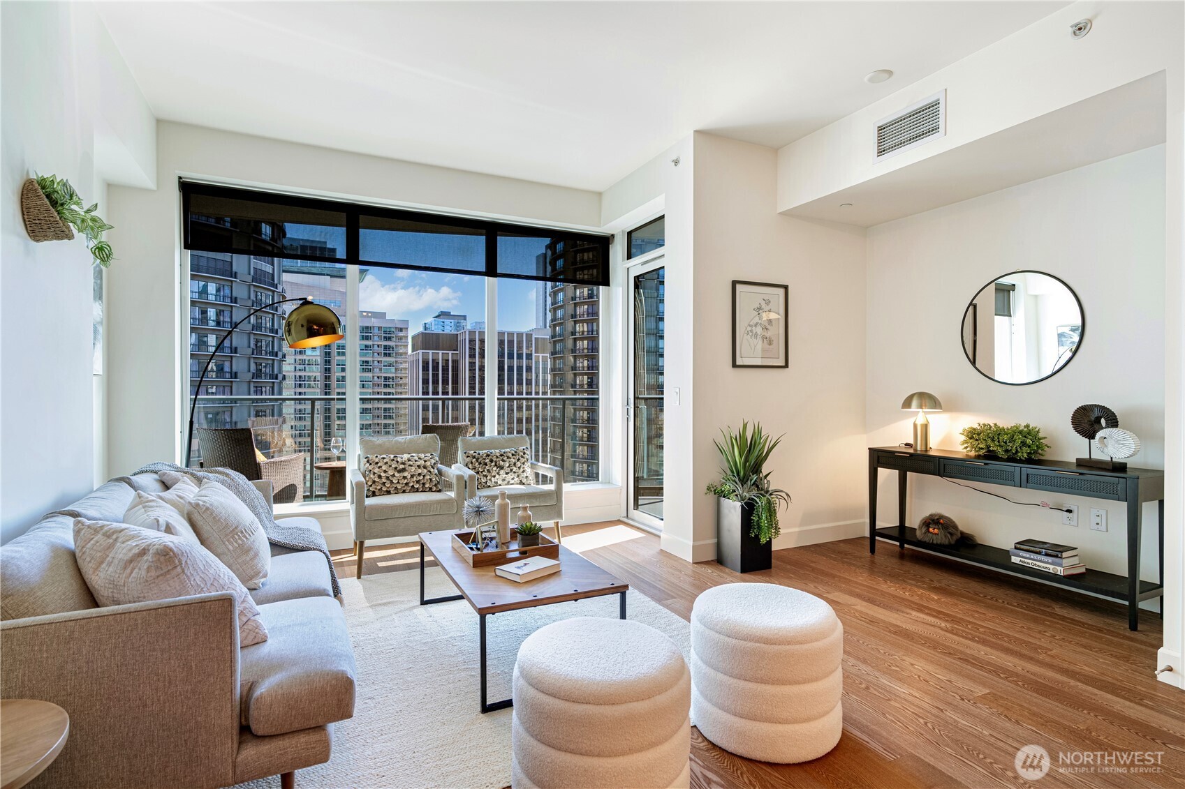 1920 4th Avenue, Unit 1809 Seattle, WA 98101 - Photo 3 of 30 a living room with furniture and a large window