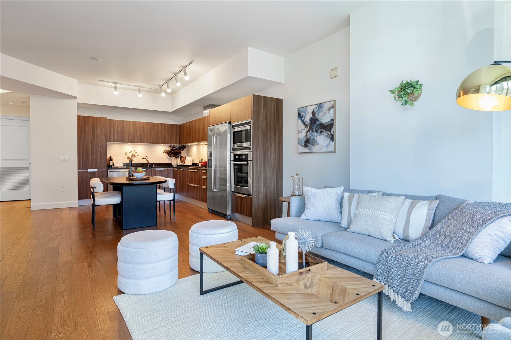 1920 4th Avenue, Unit 1809 Seattle, WA 98101 - Photo 6 of 30 a living room with furniture and wooden floor