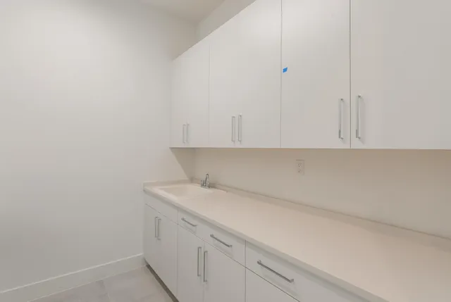 a view of storage area and utility room