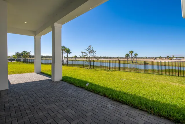 a view of a swimming pool with an ocean view