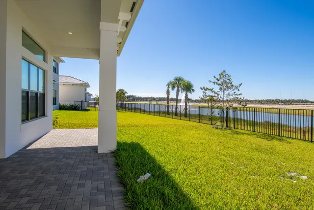 a view of a swimming pool with an outdoor space and seating area
