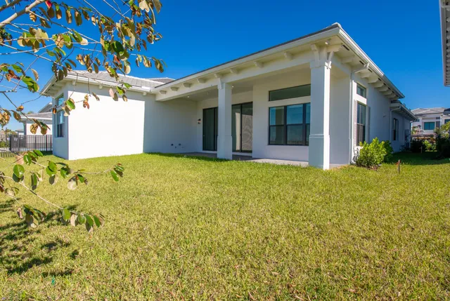 a view of a house with a small yard