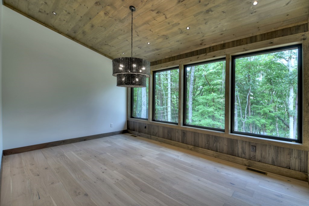 2596 Hwy 2 Blue Ridge Blue Ridge, GA 30513 - Photo 12 of 56 a view of an empty room with wooden floor and a window
