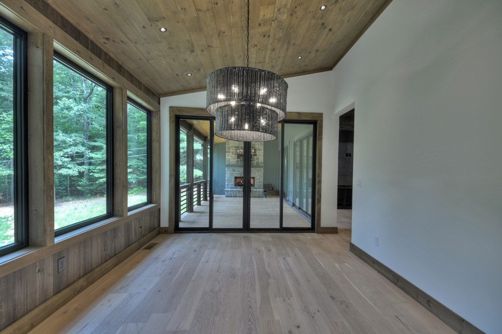 2596 Hwy 2 Blue Ridge Blue Ridge, GA 30513 - Photo 13 of 56 a view of a livingroom with furniture wooden floor and chandelier